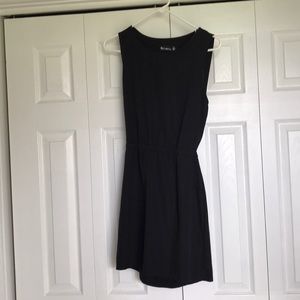 Backless black mini with zip detail